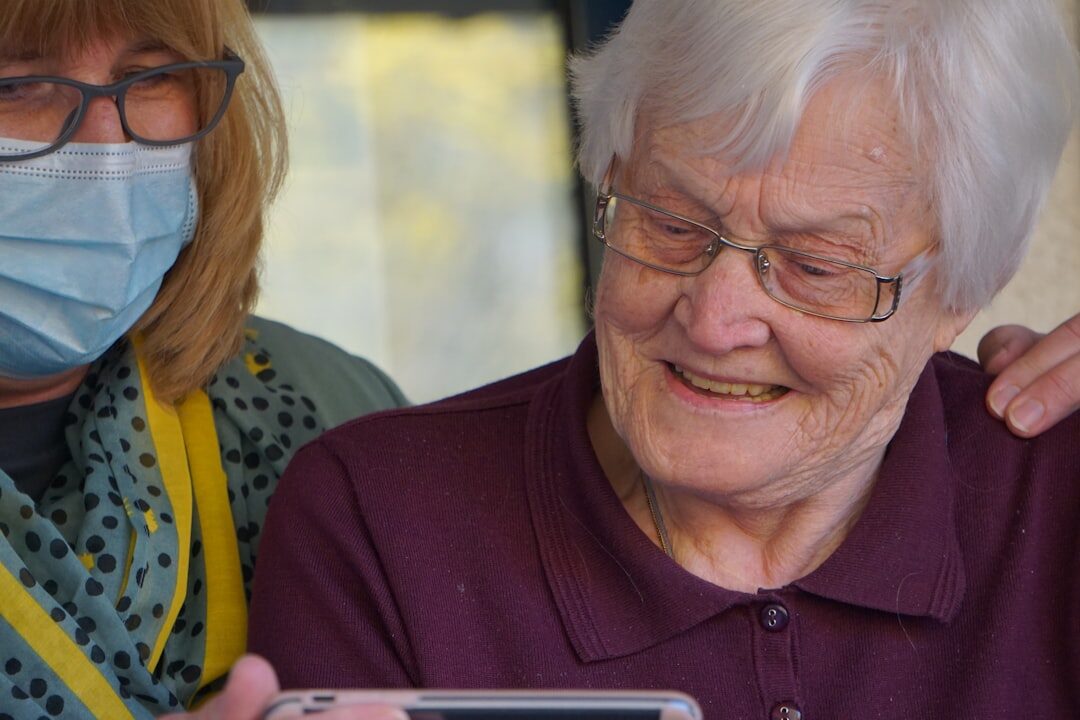 elderly woman using tablet